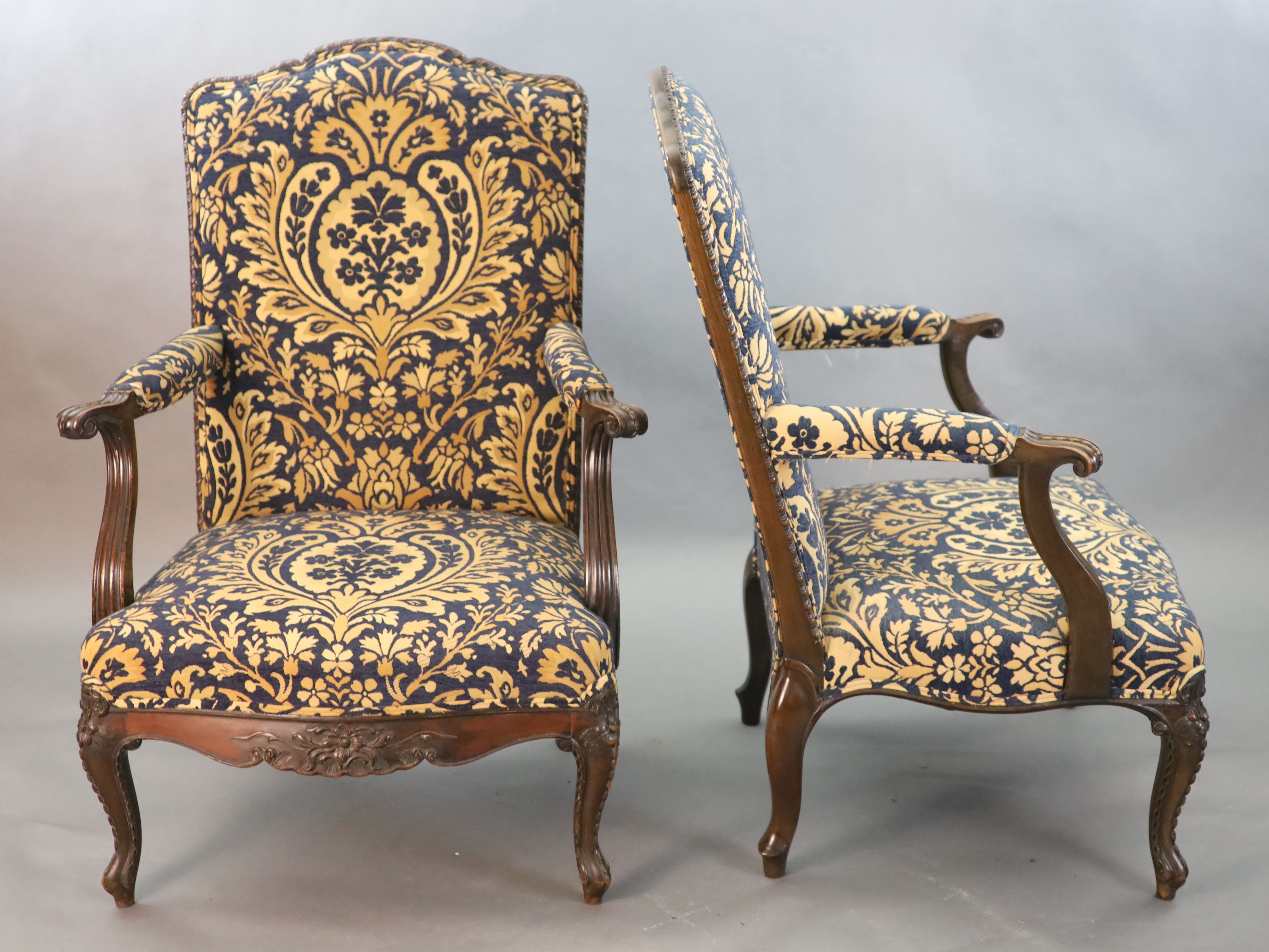 A pair of Louis XVI style mahogany fauteuils, W.2ft 6in. D.2ft 5in. H.3ft 6in.